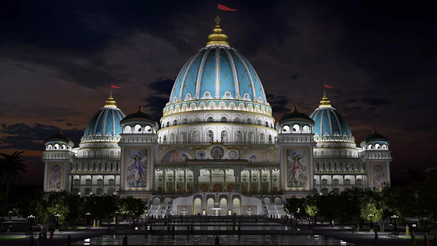 The blue dome of the Temple of the Vedic Planetarium illuminated at night